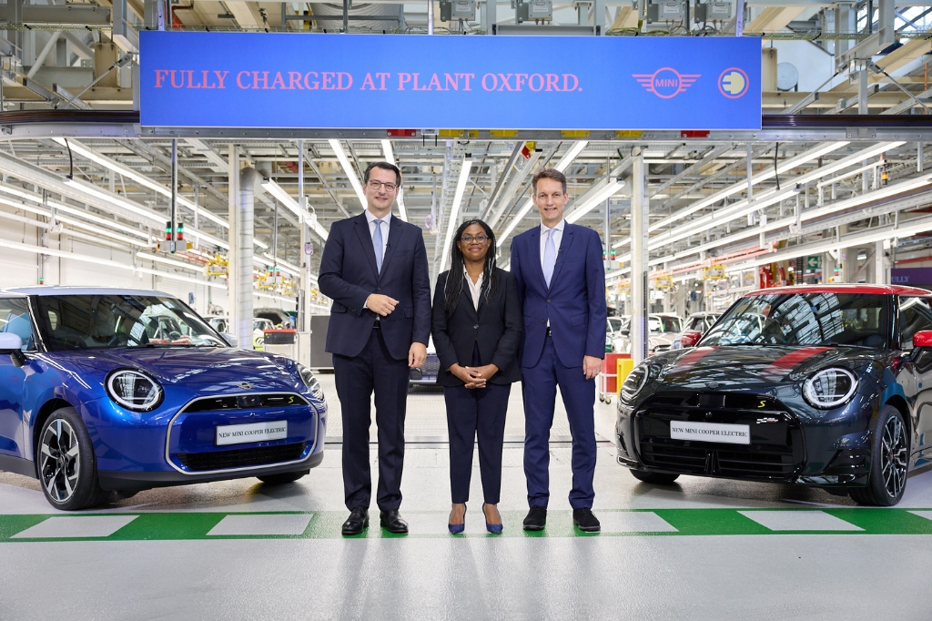 Three employees at the MINI Oxford plant which is now all electric